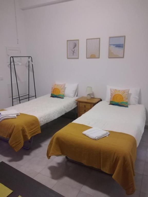 Postel nebo postele na pokoji v ubytování Casa Amarela