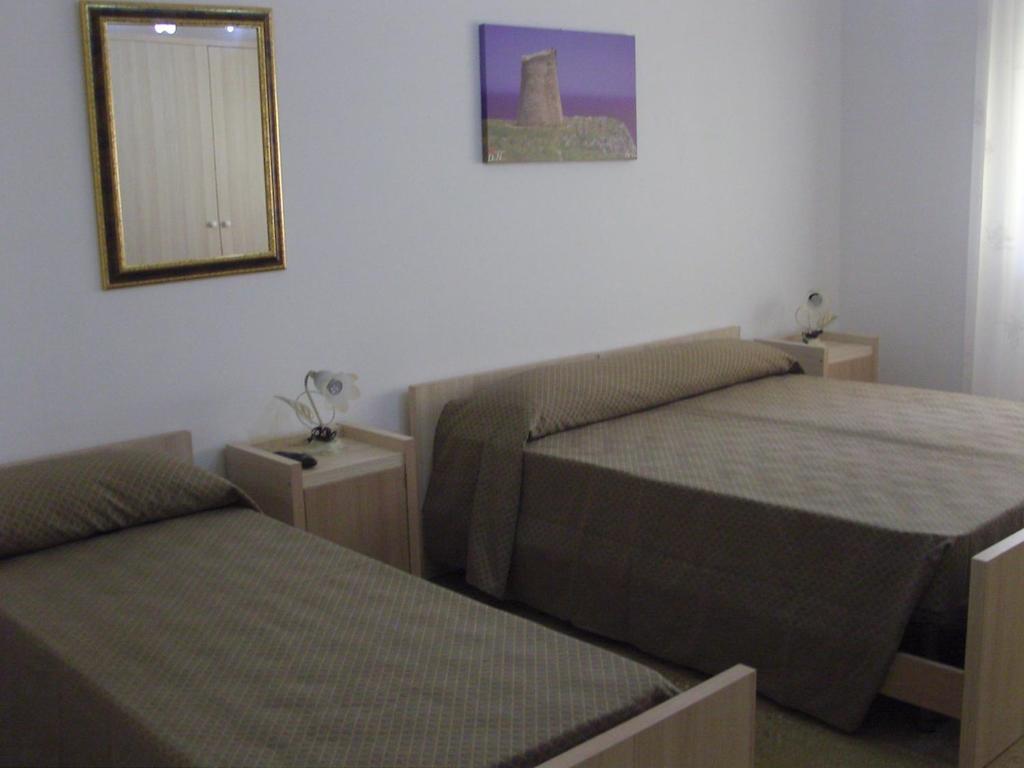 Postel nebo postele na pokoji v ubytování Don Nicola Residence