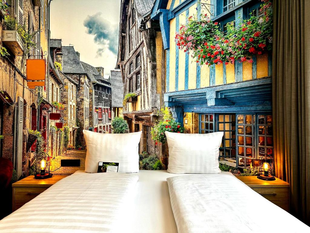 a large white bed in the middle of a street at Designhotel Central Fulda in Fulda