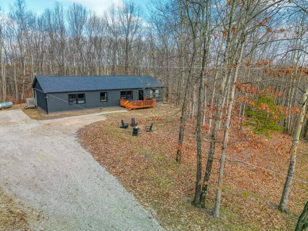 an aerial view of a small house in the woods at Buckingham Woods I Hocking Hills in Logan