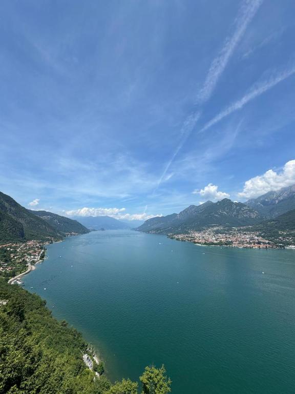 a large body of water with a city in the background at Monolocale Riva Lake in Valbrona