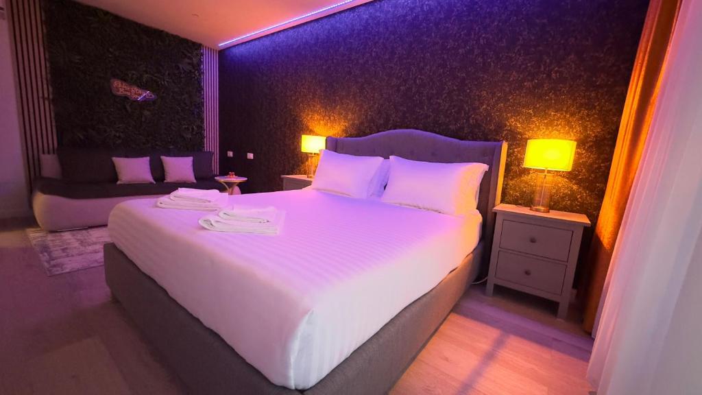 En eller flere senge i et værelse på Relax Stay Brasov