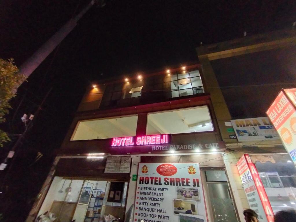 a building with a neon sign on top of it at TRPOTELS Shree Ji in Gwalior