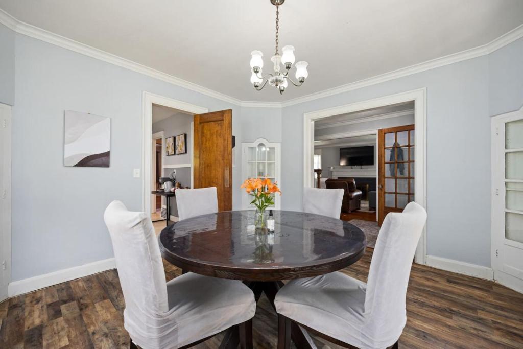 a dining room with a table and white chairs at 1515 Callender, unit 2 in Peoria