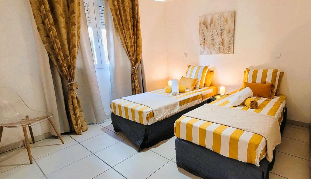 En eller flere senge i et værelse på KANEL - Votre havre de paix à lAnse Mitan