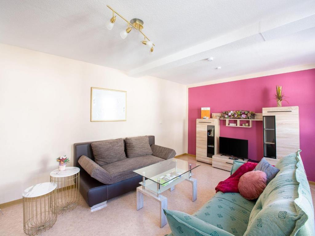 a living room with a couch and a table at Wohnung in Battenberg nahe Winterberg Skigebiet in Battenberg