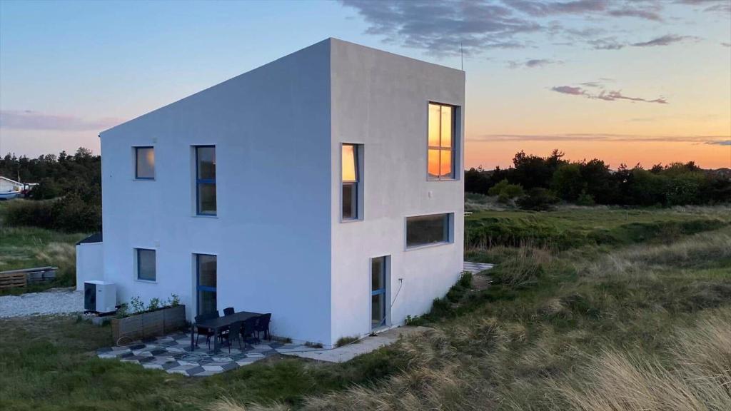 a white house in the middle of a field at 302-Snedsted-Klitfogedvej-7 in Snedsted