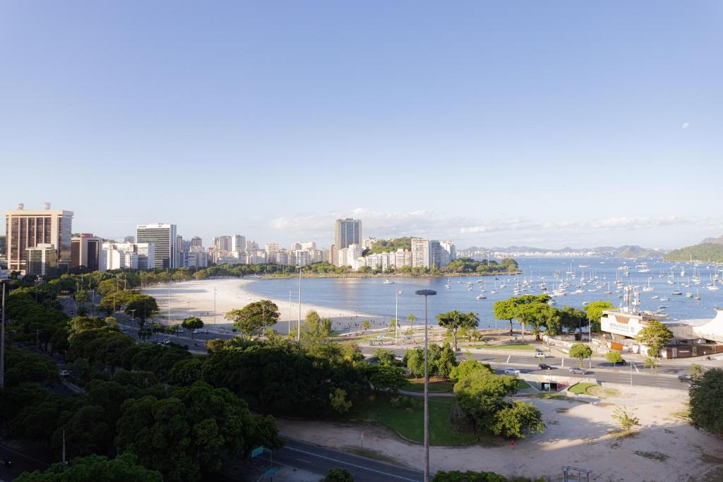 a view of a city and a body of water at 360 Botafogo Belair By SUHCasa in Rio de Janeiro