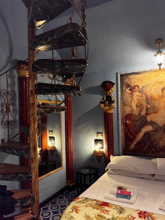 a bedroom with a bed and a painting on the wall at Domus Almapetra ai Fori Imperiali in Rome