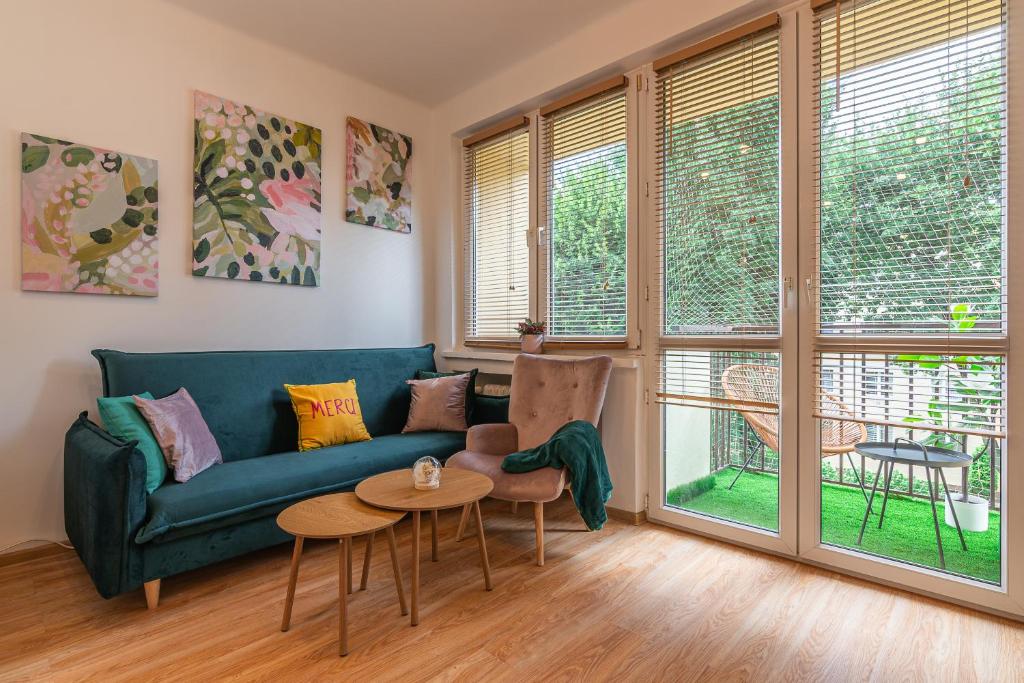 a living room with a couch and a table at Apartament HoliStay in Oświęcim