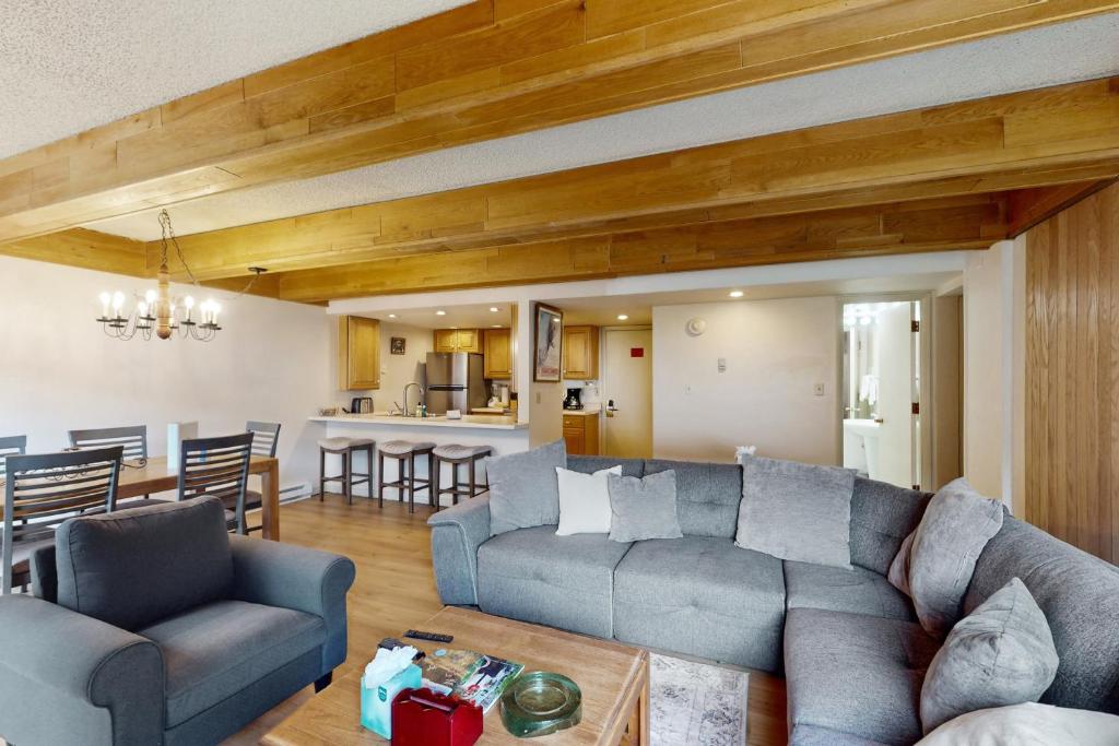 a living room with a couch and a table at Vail International #3 in Vail