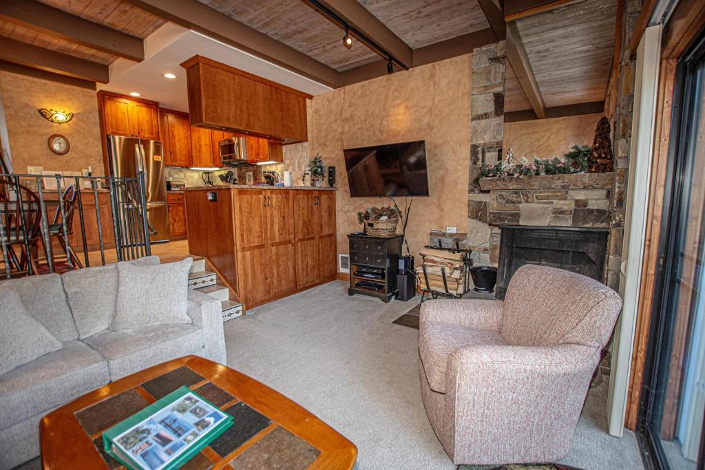 a living room with a couch and a table at Star Harbor # 27 By Hauserman Rentals in Tahoe City