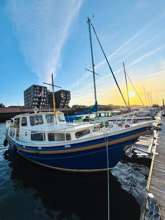 a boat docked at a dock in the water at Holländisches Stahlboot in Bremen
