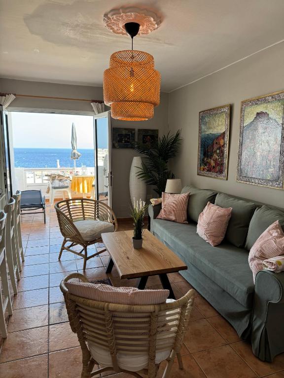 a living room with a couch and a table at Azul 41 - Puerto Del Carmen Harbor with Oceanview, pet friendly, Pool in Tías