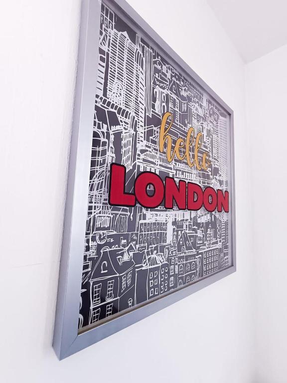 a framed picture of a city with the words london at Pequeña habitación London en GDL in Guadalajara