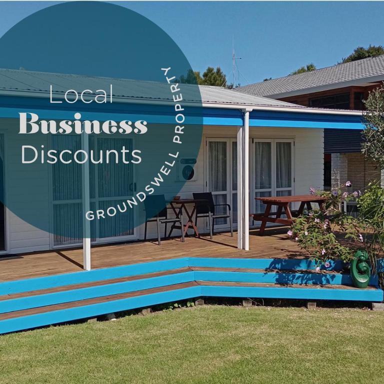 a sign for a local businessdsdsystems company in a house at Calypso Cottage, Bright bach, Water view in Raglan