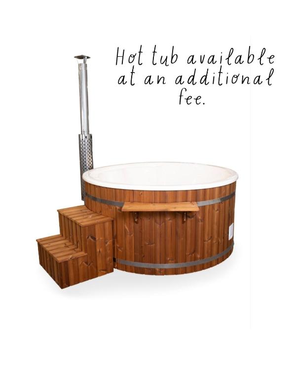 an illustration of a wooden bathtub with the words hot tub upgrade at an aquarium at Orchard Brooke Cottage in Downpatrick