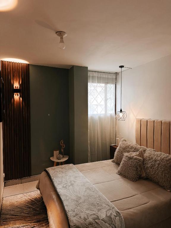 Voodi või voodid majutusasutuse Aquí, cada rincón te abraza, punto céntrico en la ciudad toas