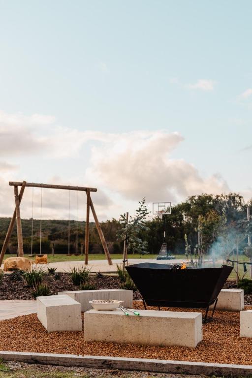 a playground with a hammock in a park at Rileystone in Margaret River Town