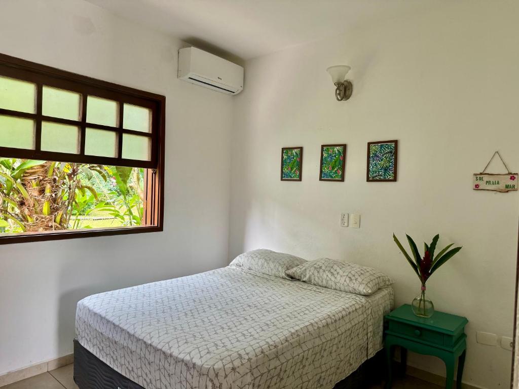 Ένα ή περισσότερα κρεβάτια σε δωμάτιο στο Chales da Lua Juquehy