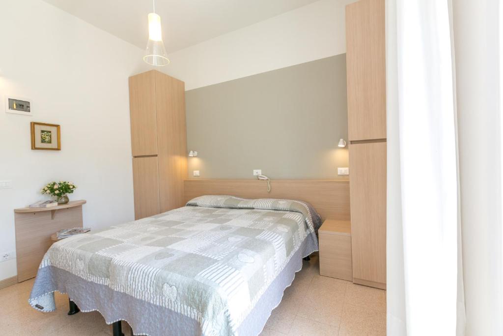 Postel nebo postele na pokoji v ubytování Hotel Colonna