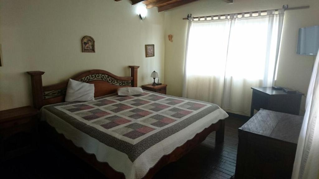 Postel nebo postele na pokoji v ubytování Finca Hotel La Ponderosa
