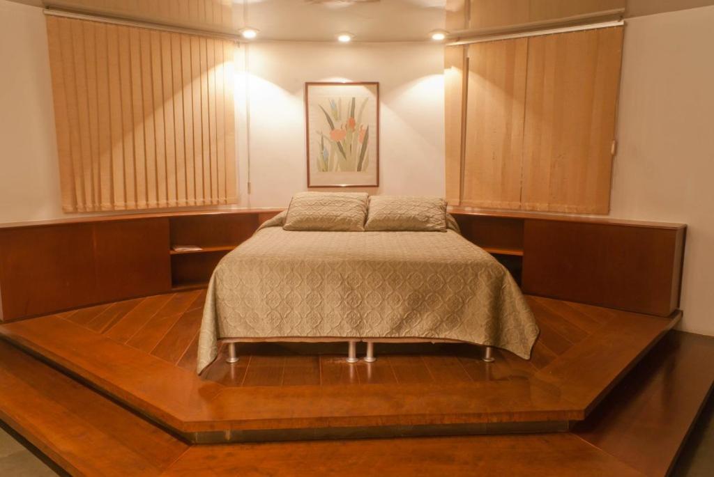 Postel nebo postele na pokoji v ubytování Minas Palace Hotel