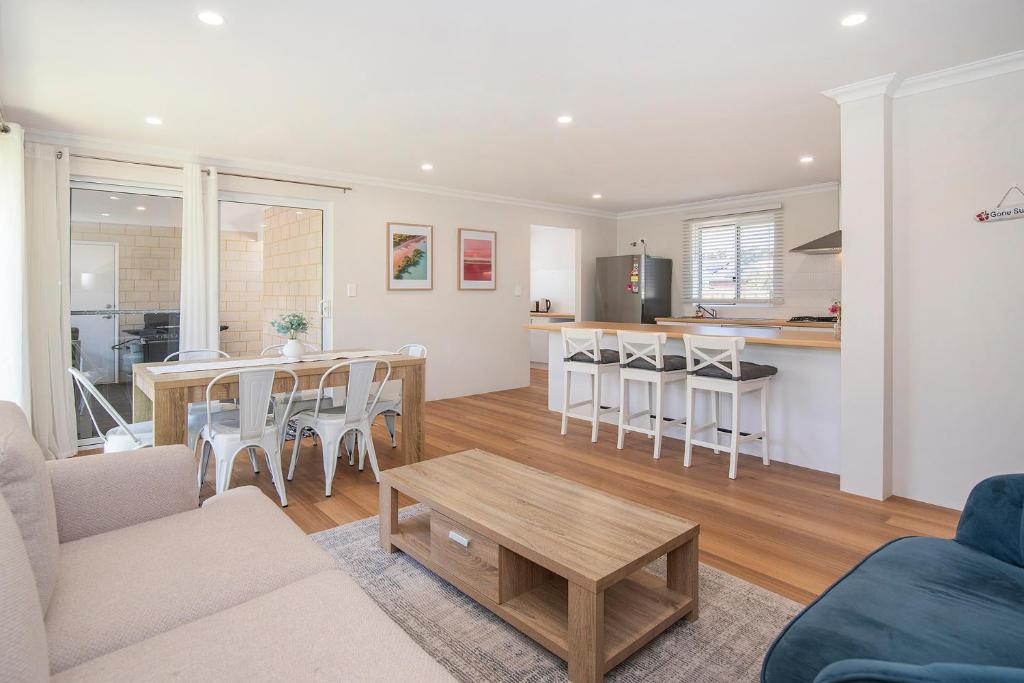 a living room and kitchen with a table and chairs at Dunsborough Sunrise in Dunsborough