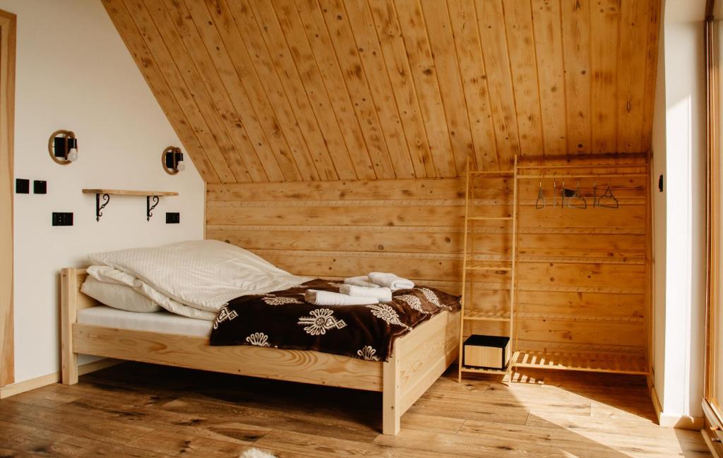 Ένα ή περισσότερα κρεβάτια σε δωμάτιο στο Czorsztyn Vista House