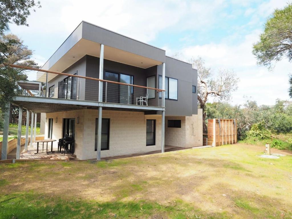a house with a large yard in front of it at 1 Anderson Avenue Sandy Point in Sandy Point