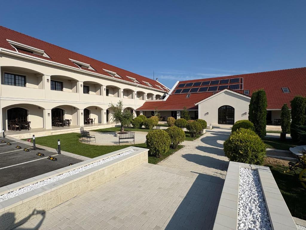 a building with a pathway in front of a building at The Nook in Pădureni