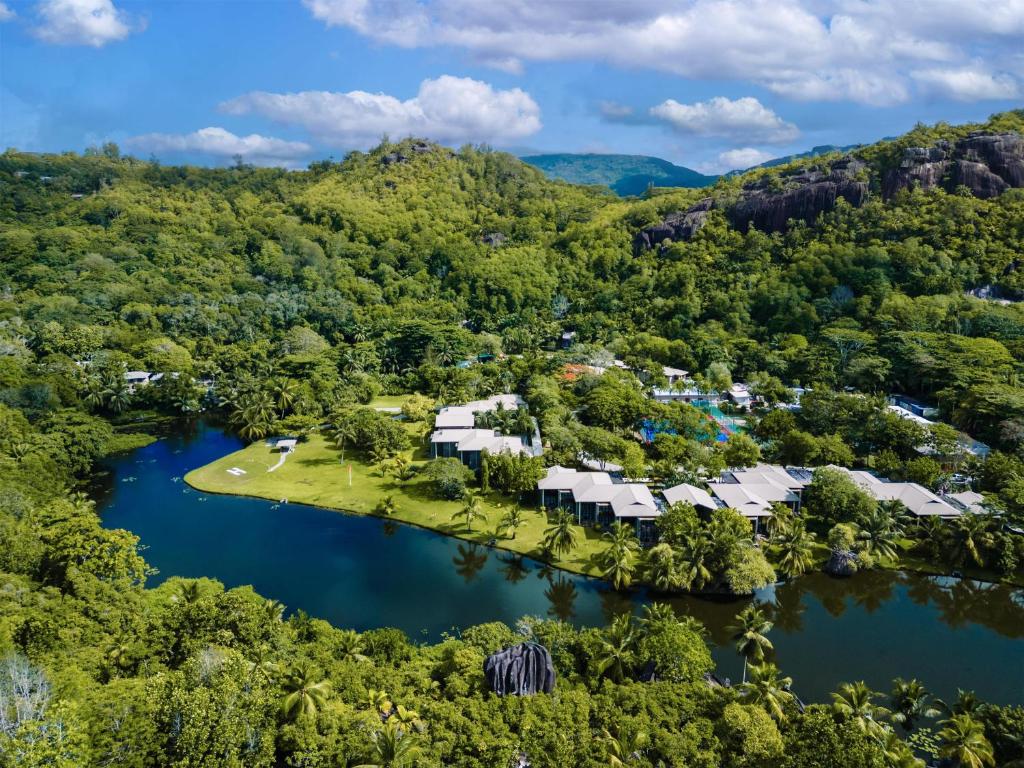an aerial view of a resort in the middle of a lake at Kempinski Seychelles Resort in Baie Lazare Mahé