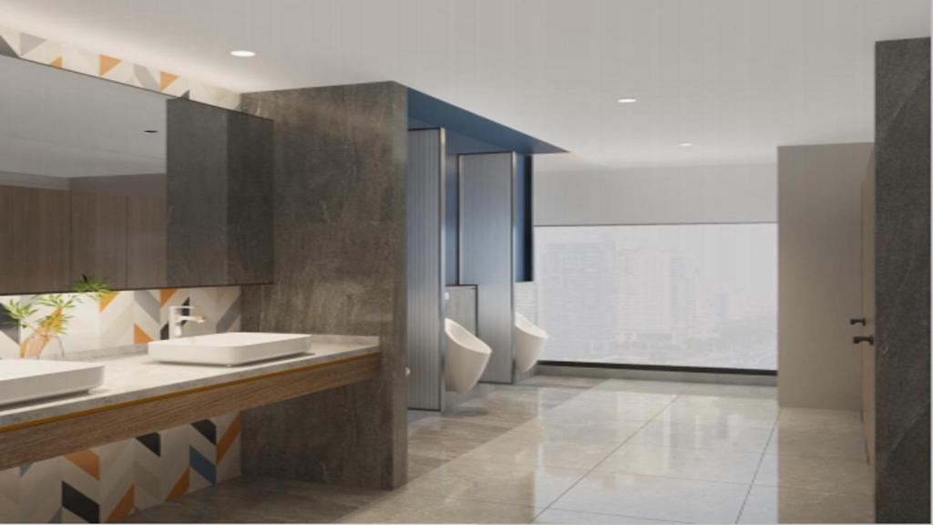 a bathroom with two sinks and a large window at Holiday Inn Express Foshan Sanshui by IHG in Foshan