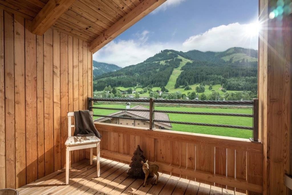 a room with a window with a view of a mountain at Marias Alpen Apartment by Alpine Host Helpers in Brixen im Thale