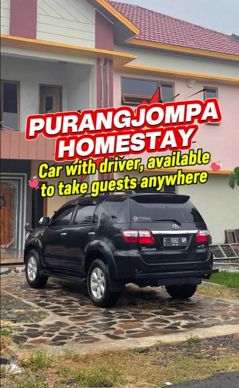 a black truck parked in front of a house at Purangjompa Homestay in Tiwuronto