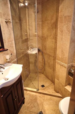 a shower with a glass door in a bathroom at Villa Katalina in Varna City