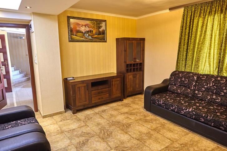 a living room with a couch and a table at Villa Katalina in Varna City