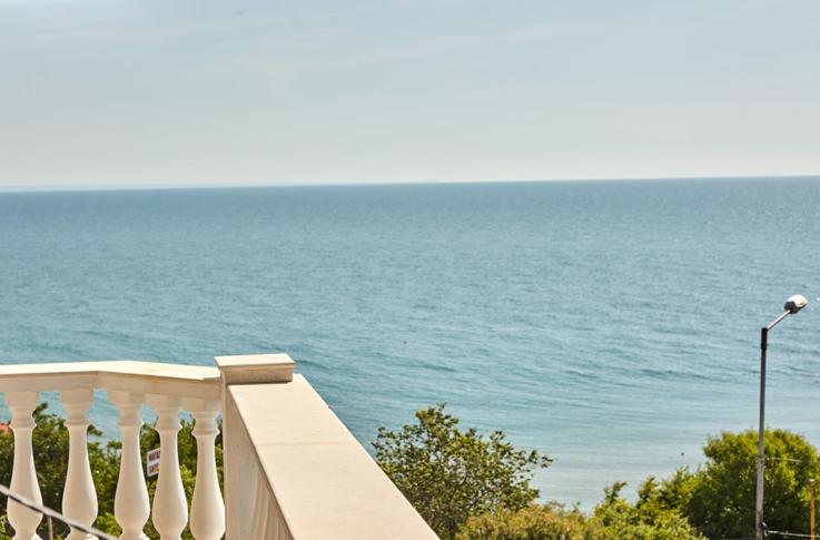 a balcony with a view of the ocean at Villa Katalina in Varna City