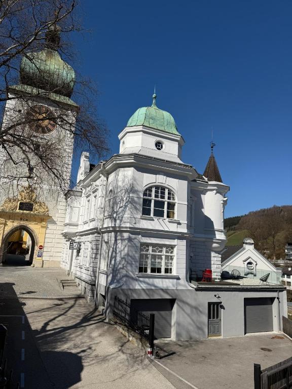 a building with a clock tower on top of it at Kerschbaumer.Apartments in Waidhofen an der Ybbs