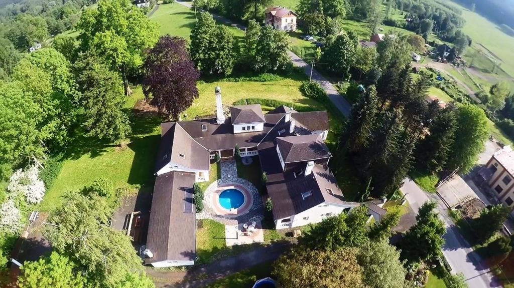 an aerial view of a house on a hill at RESORT CHŘIBSKÁ Apartmány Adri in Chřibská