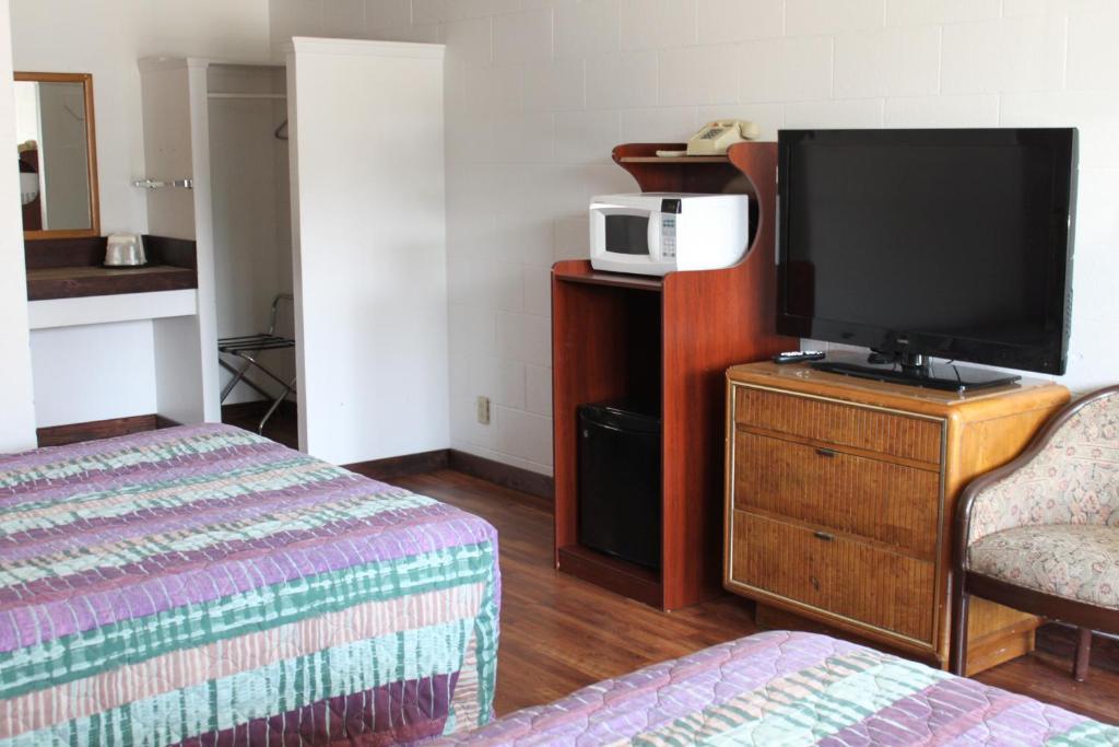 Postel nebo postele na pokoji v ubytování Motel 101