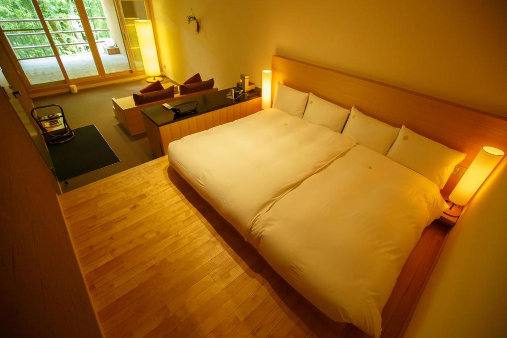 Postel nebo postele na pokoji v ubytování Kinnotake Tonosawa (Adult Only)