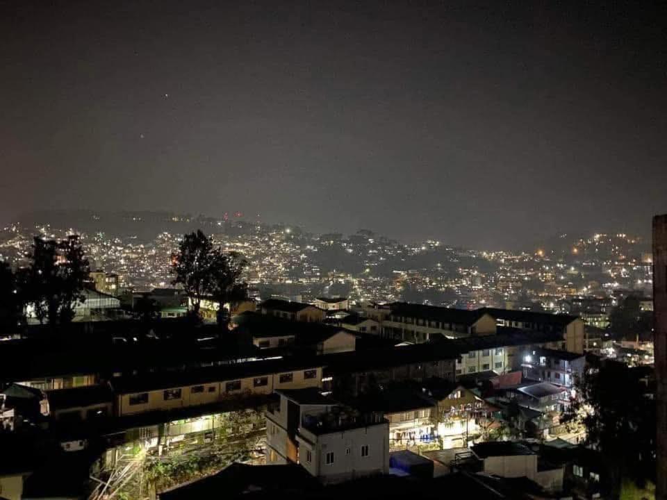 a view of a city at night with lights at Unit 302, 3rd Floor in Baguio