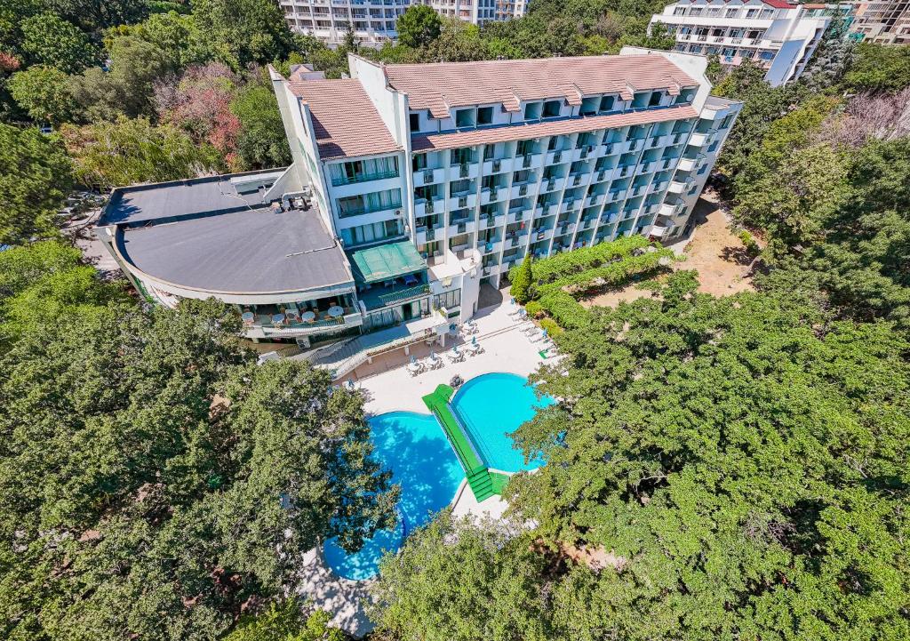an overhead view of a hotel building with a swimming pool at Hotel Zdravets in Varna City