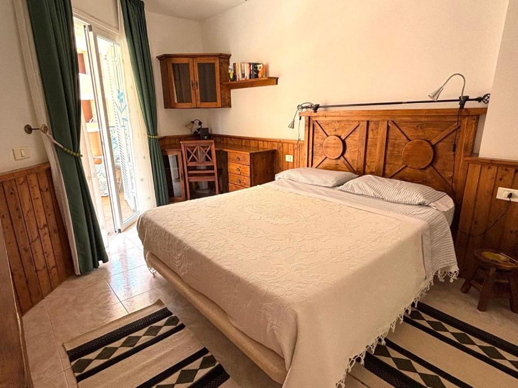 a bedroom with a large bed in a room at Veliero en Costa Sol M13 in Costa Del Silencio
