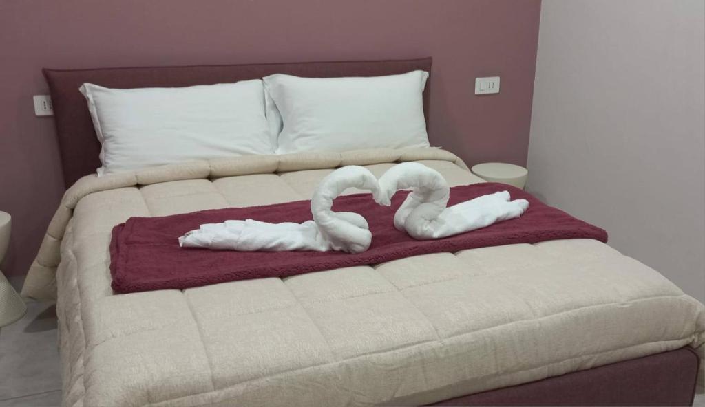 Ένα ή περισσότερα κρεβάτια σε δωμάτιο στο Regia Dimora