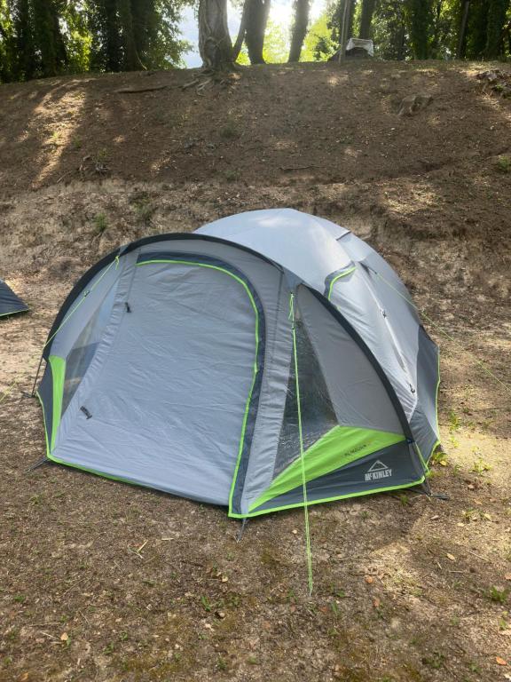 a tent sitting on the ground in a field at Camping Tent JUNIOR in Danilovgrad