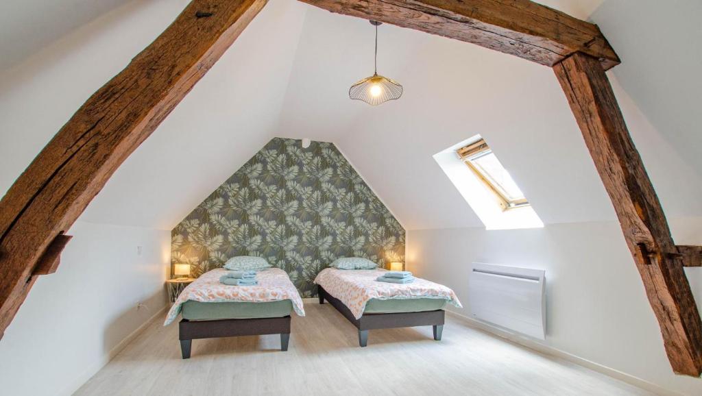 Ένα ή περισσότερα κρεβάτια σε δωμάτιο στο Chez mamie gigi