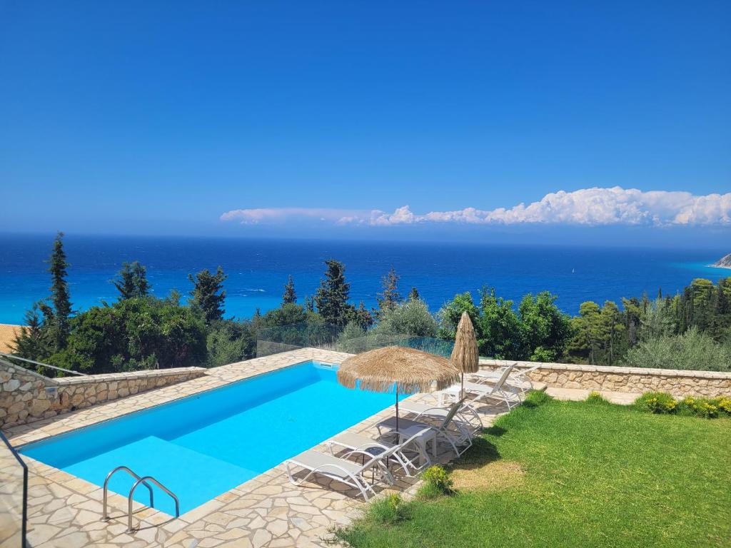 a villa with a swimming pool and a view of the ocean at Villa ioli breathtaking view & sunset in Agios Nikitas