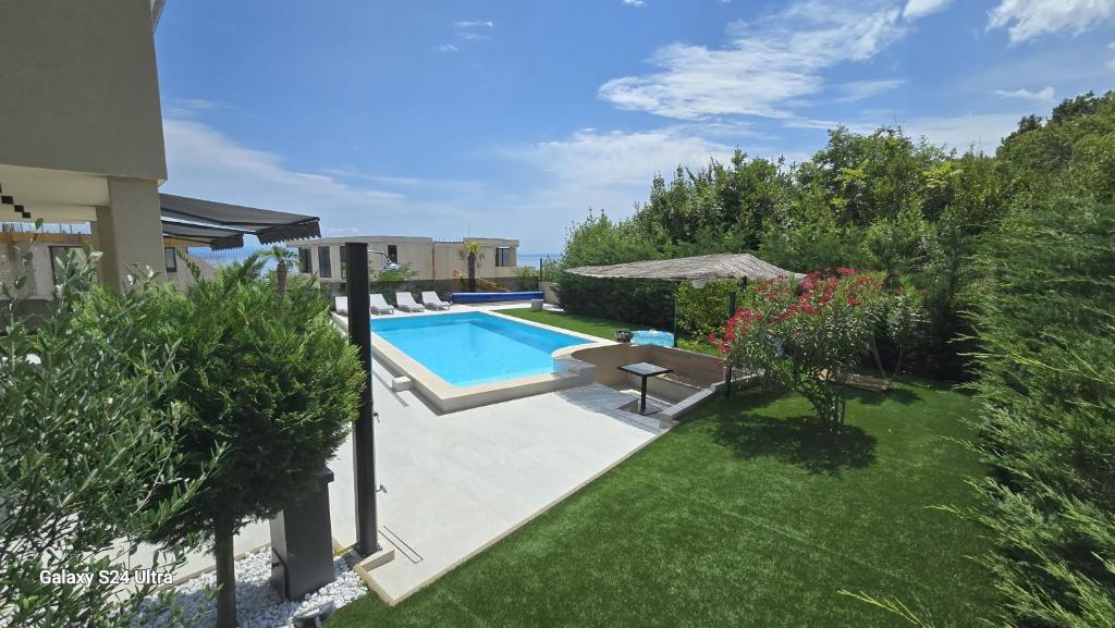 a swimming pool in the backyard of a house at Villa Marea in Opatija